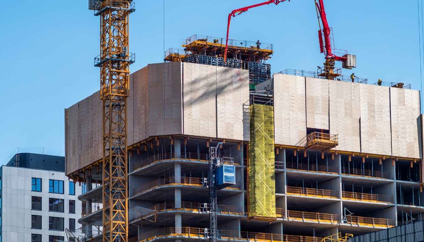 Illustration of an integrated commercial center combining shops, offices, and community services in a city environment